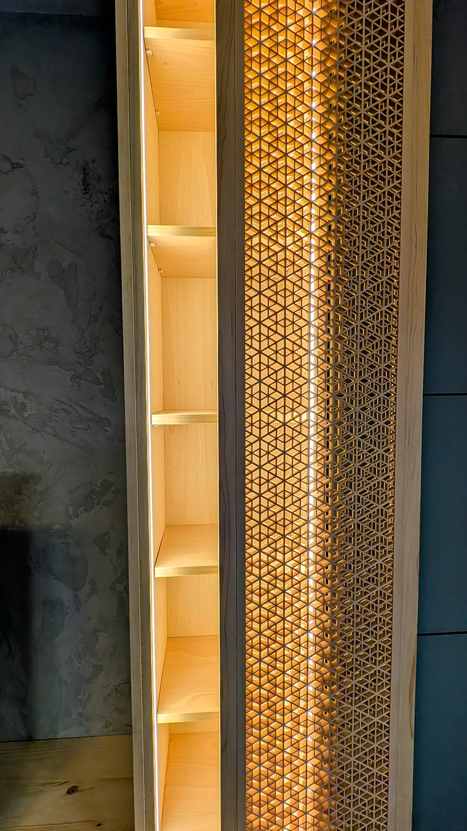 Close view of fine timber kumiko integrated into an illuminated cabinet door