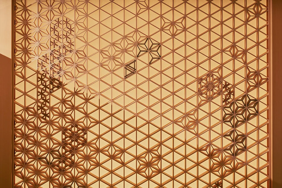 Close view of varied wooden lattice patterns in a TANIHATA kumiko panel at ESPACIO Nagoya Castle